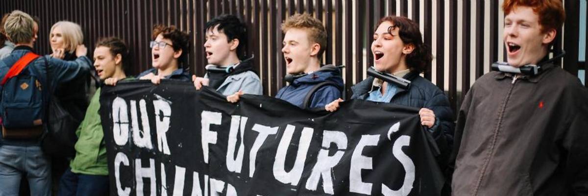 Demanding Urgent Action on Climate Emergency, Youth Lock Their Necks to UK Parliament's Gates