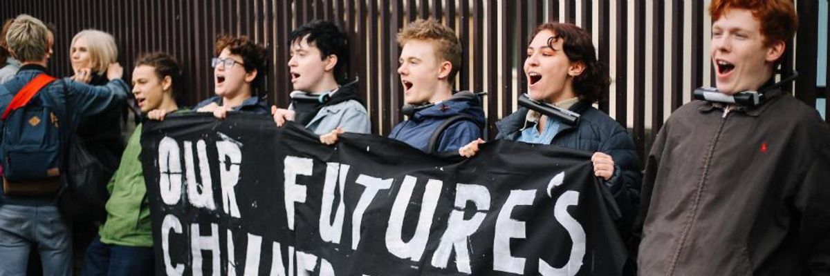 Demanding  Urgent Action on Climate Emergency, Youth Lock Their Necks to UK Parliament's Gates