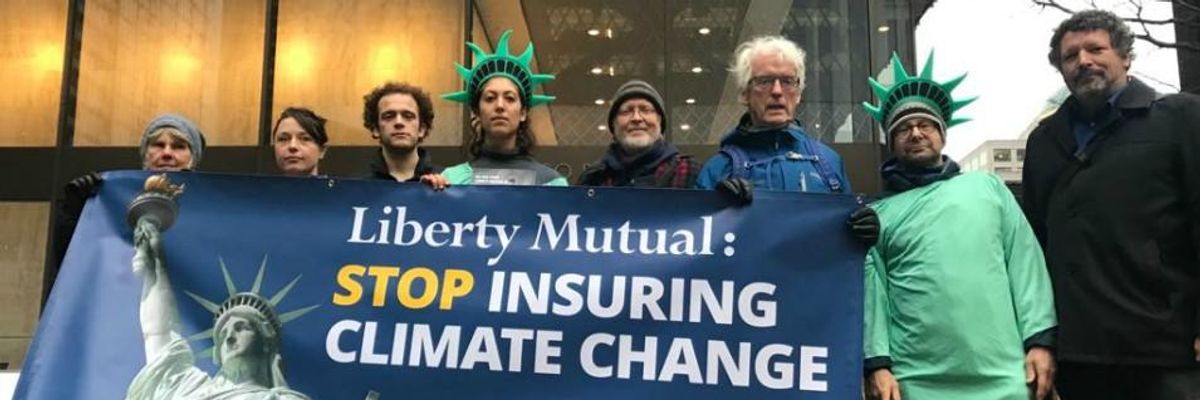 Activists with Insure Our Future gathered outside Liberty Mutual's Boston and Seattle offices in December 2019