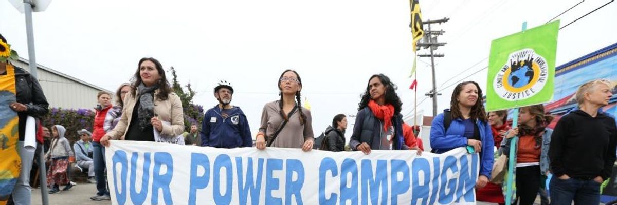 Activists with the Our Power Campaign march in a 2014 rally
