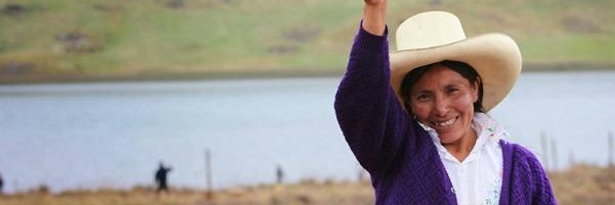 Acuna de Chaupe at her property in front of the Blue Lagoon