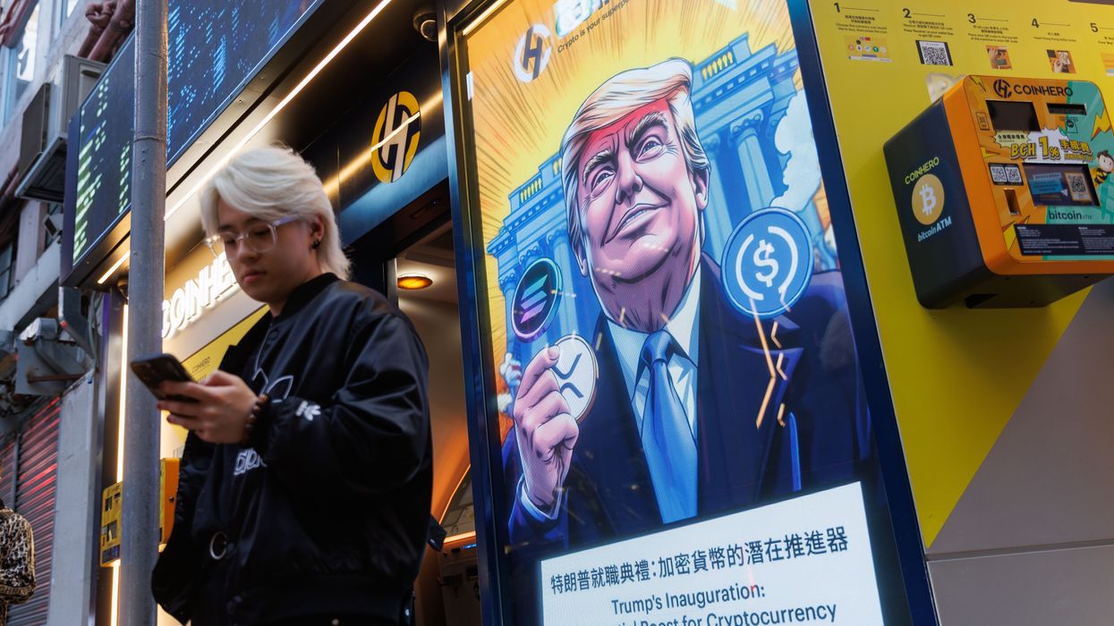 ad shows Trump holding various cryptocurrencies