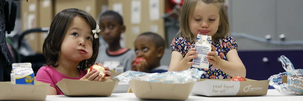 Addison (left), 2 years old, and Mia (right), 23 months old, have lunch at the children's center of the main library in San Francisco, Calif., on Monday, July 20, 2015. About 13,000 meals are served on a daily basis by a DCYF, a free summer meal program