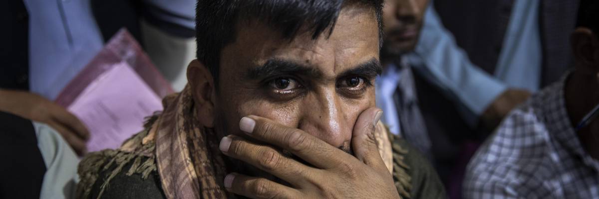 Afghan Special Immigrant Visa applicants crowd into the Herat Kabul Internet cafe