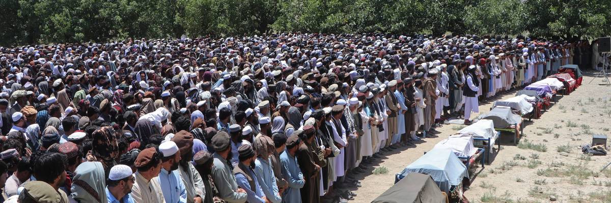 Afghans gather to mourn people killed by Pakistani airstrikes