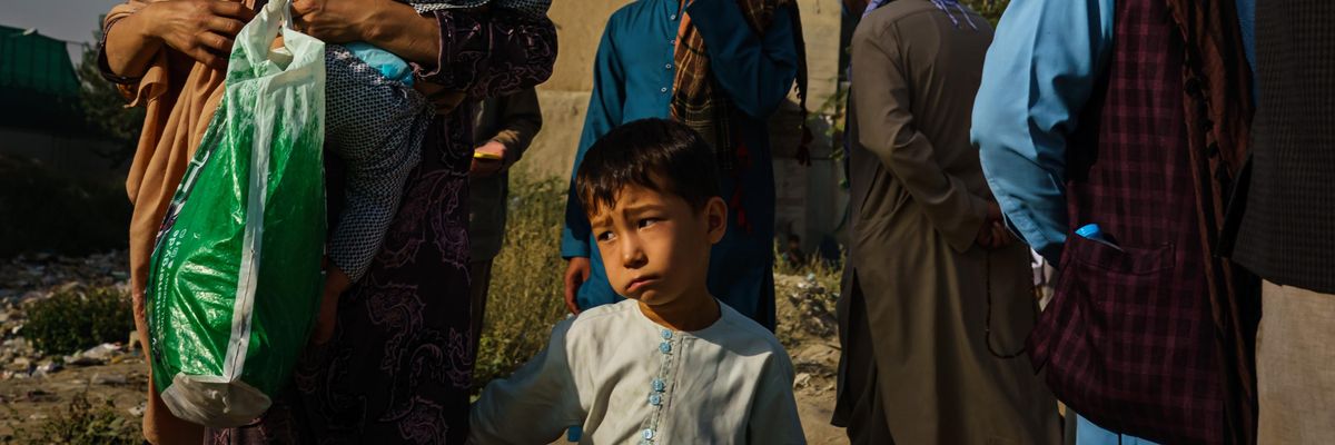 Afghans make their way to the military entrance of the airport for evacuations in Kabul, Afghanistan on August 19, 2021. (Photo: Marcus Yam/Los Angeles Times via Getty Images)