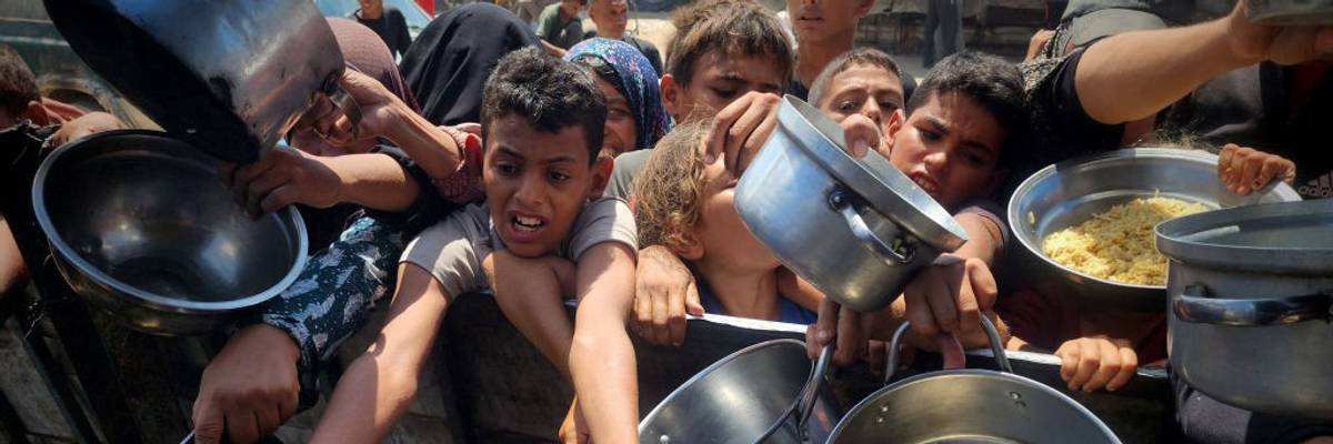 Aid organizations in Gaza distribute hot meals to Palestinians