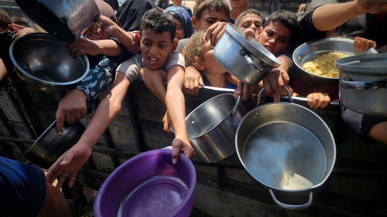 Aid organizations in Gaza distribute hot meals to Palestinians