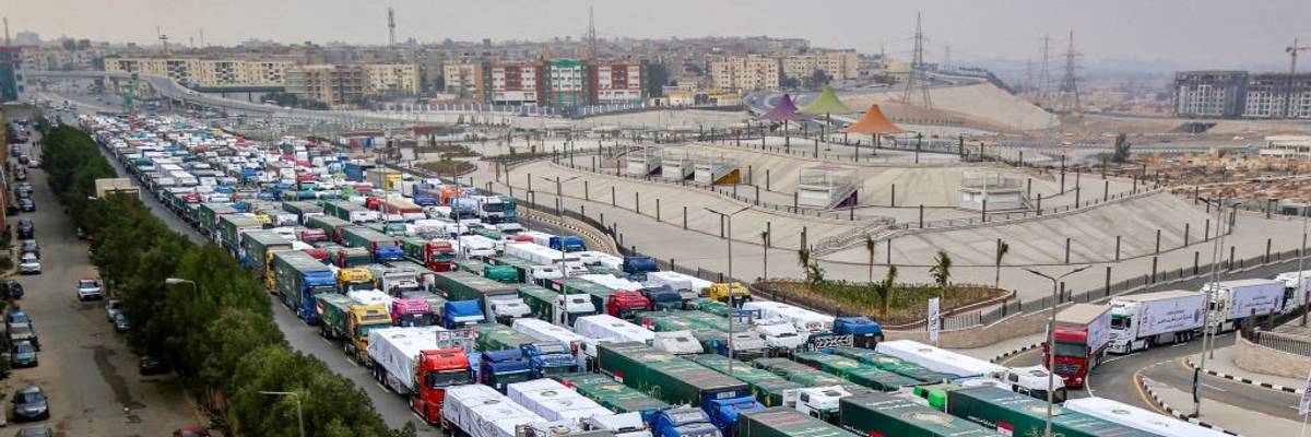 aid trucks bound for Gaza queue outside Cairo