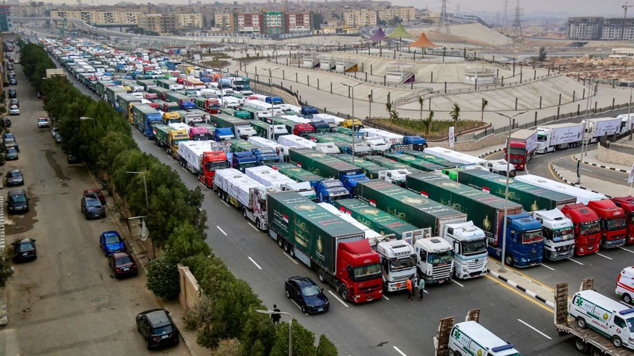 aid trucks bound for Gaza queue outside Cairo