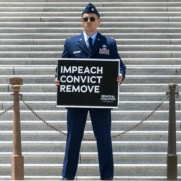 Air Force Major Who Called for Trump’s Impeachment Is in Solitary Confinement 24 Hours a Day