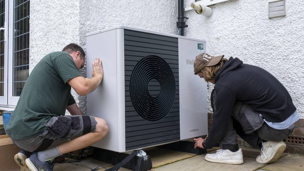 Air source heat pump installers from Solaris Energy installing a Vaillant Arotherm plus 7kw air source heat pump unit into a 1930s built house in Folkestone, United Kingdom on September 20, 2021.