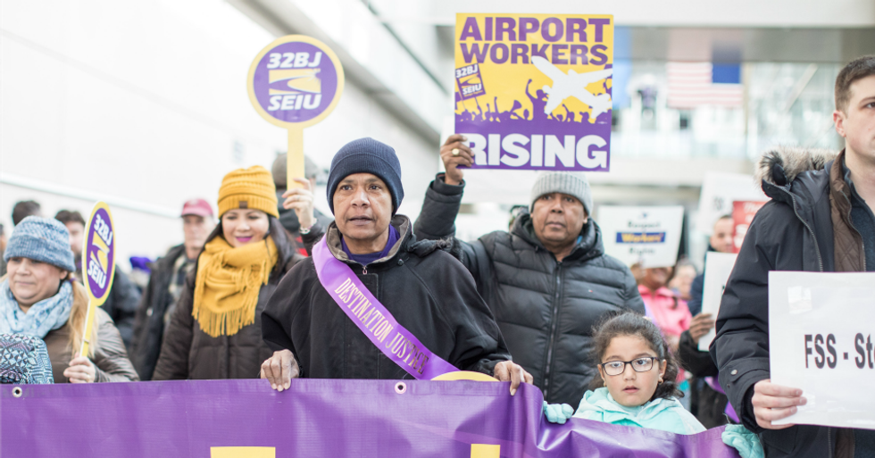 Airport workers hold signs and march during a rally for employees affected by the government shutdown at Boston Logan International Airport on January 21, 2019 in Boston, Massachusetts. (Photo: Scott Eisen/Getty Images)