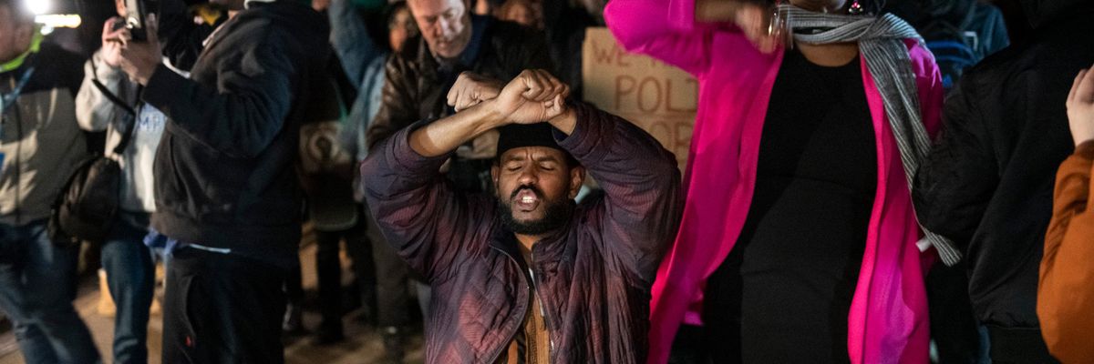 Ajib Ahmed crosses his arms in front of traffic on the Memphis-Arkansas bridge along with other protesters after the release of video showing police beating to death Tye Nichols.