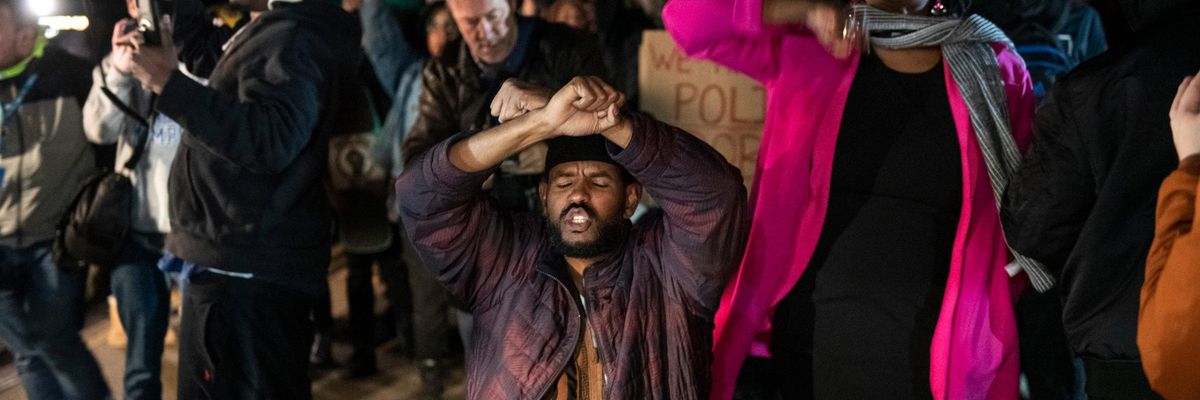 Ajib Ahmed crosses his arms in front of traffic on the Memphis-Arkansas bridge along with other protesters after the release of video showing police beating to death Tye Nichols. 