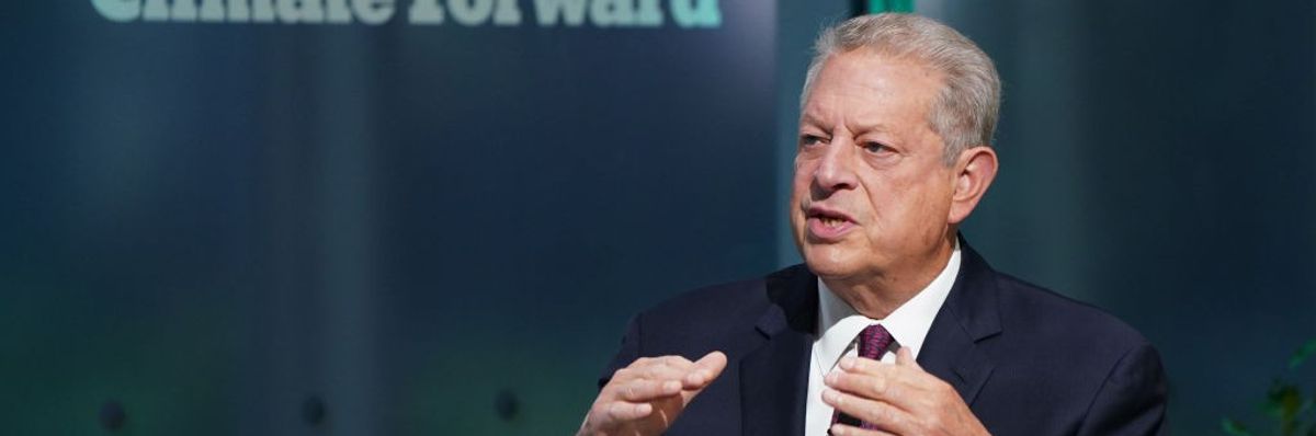 Al Gore speaks on a stage.