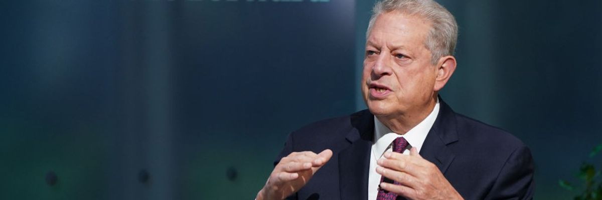 Al Gore speaks on a stage.