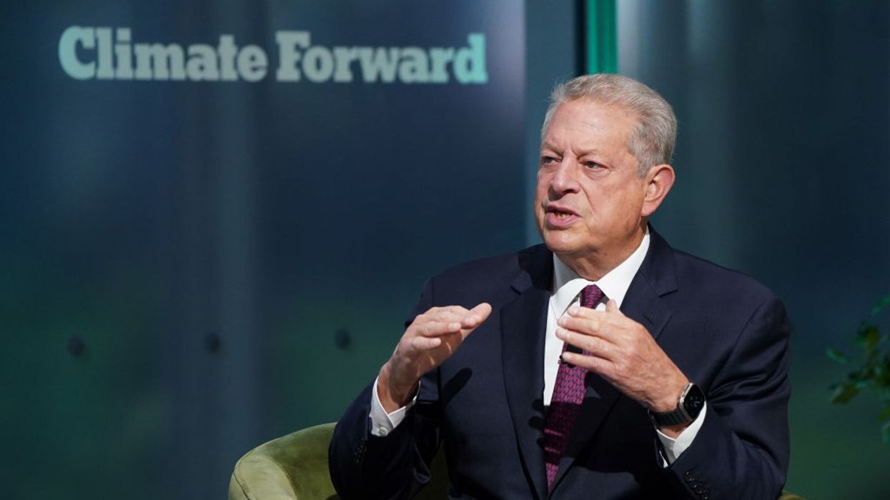 Al Gore speaks on a stage.