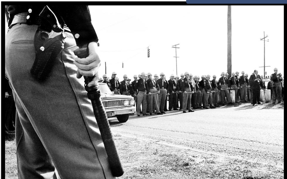 Alabama state troopers form roadblock on far side of Edmund Pettus Bridge. 