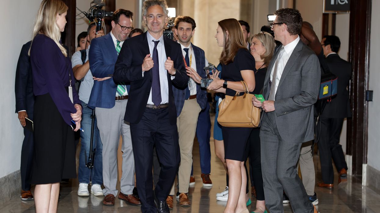 Alex Karp leaves Senate meeting.