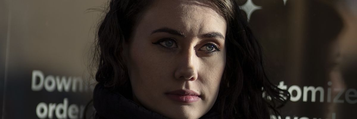 Alexis Rizzo, a former shift supervisor at Starbucks, stands for a portrait