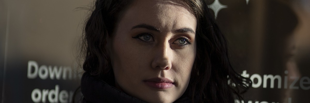 Alexis Rizzo, a former shift supervisor at Starbucks, stands for a portrait