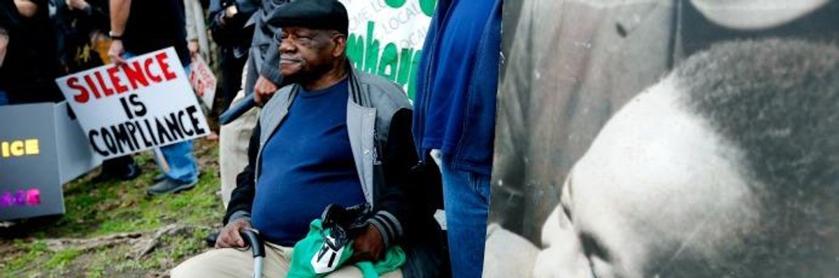 Alvin Turner, who was a sanitation worker in Memphis for 34 years and marched alongside Martin Luther King Jr. during the strike in 1968, listens to speeches before the annual march on Jan. 16, 2017 in Memphis, Tennessee