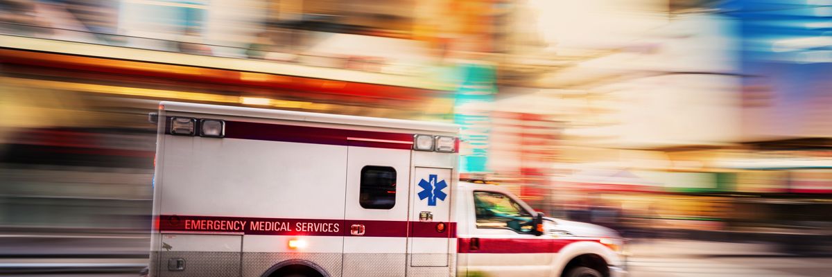 Ambulance racing through city street