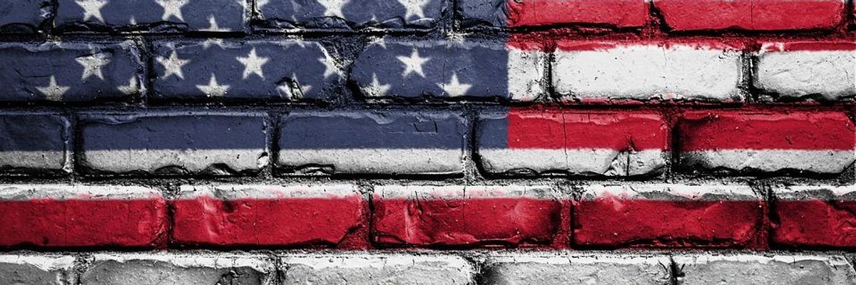 American flag painted on brick wall