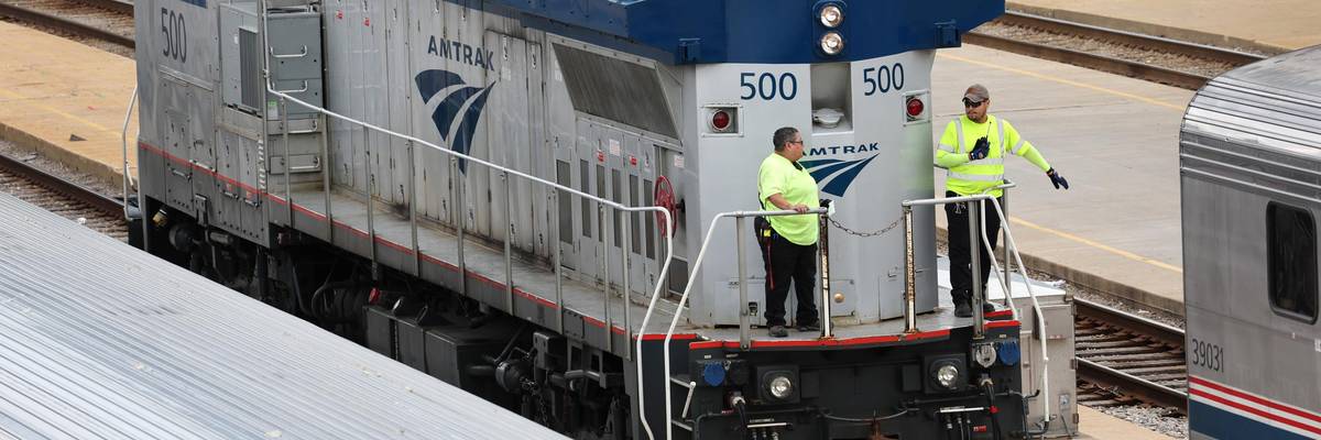 Amtrak workers service trains