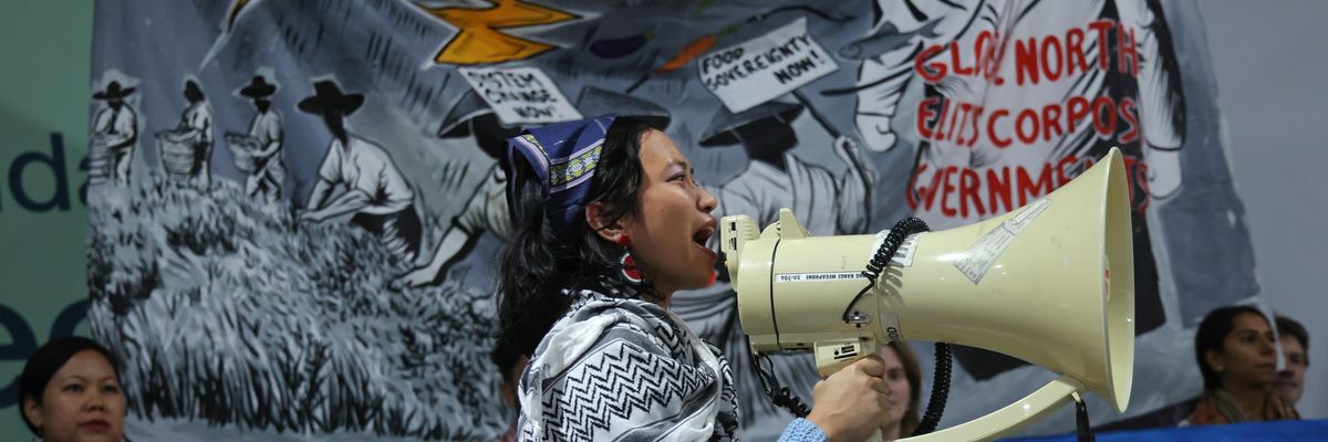 An activist speaks into a megaphone.