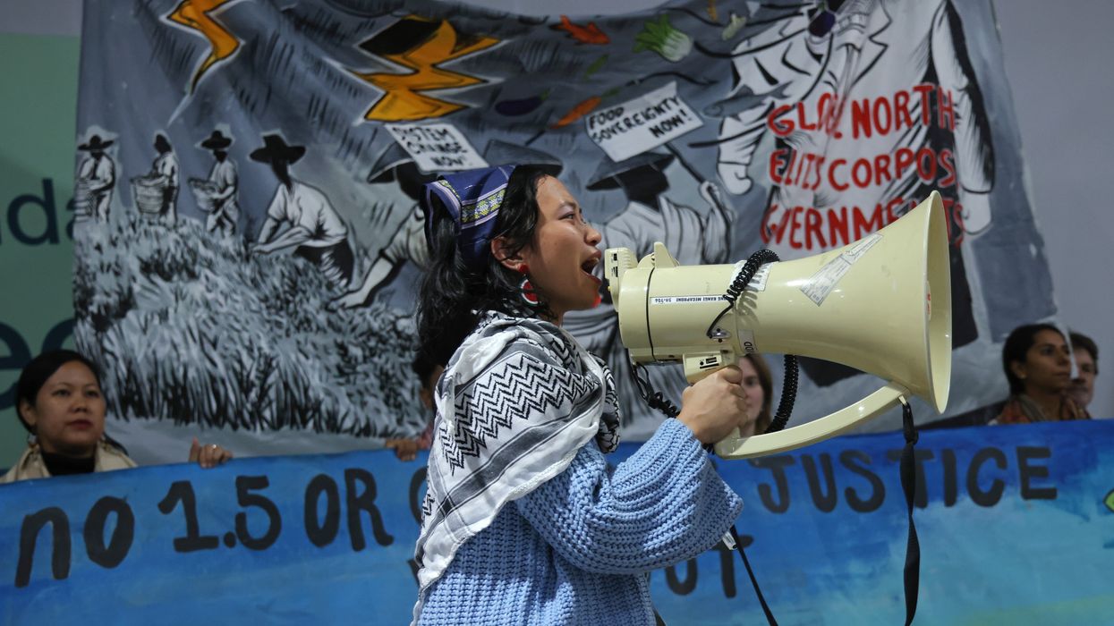 An activist speaks into a megaphone.