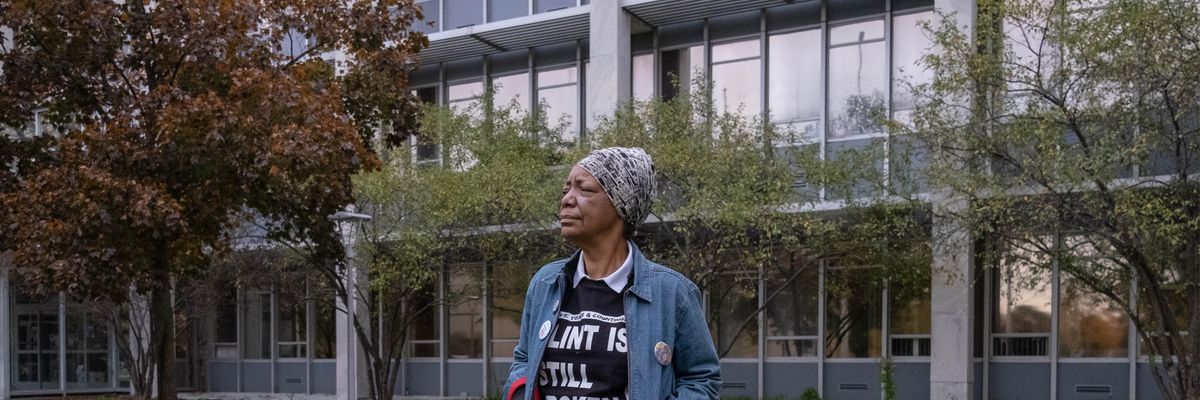 An activist stands outside City Hall in Flint, Michigan