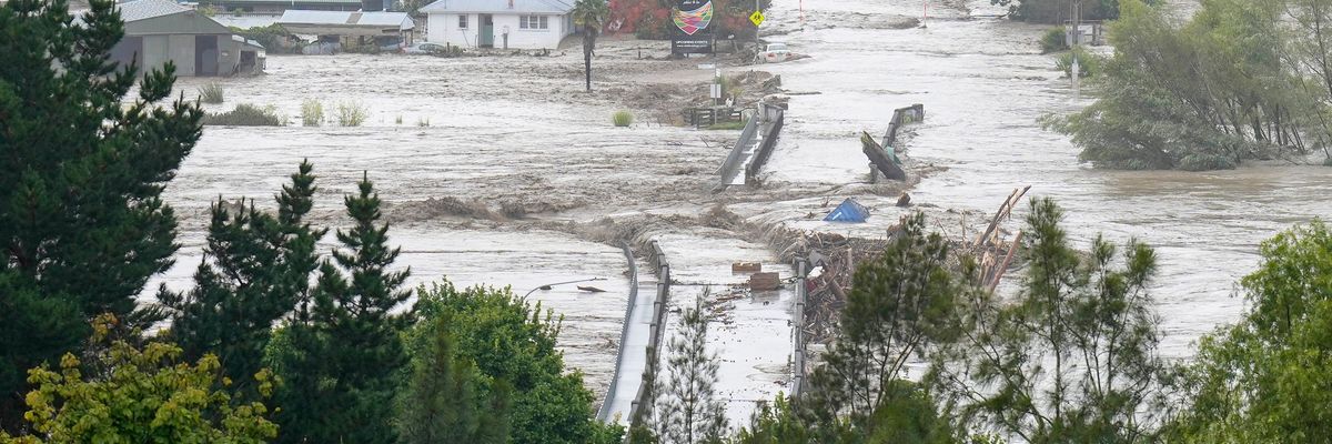 An aerial photo taken on February 14, 2023 shows the Waiohiki bridge and surrounds inundated by the Tutaekuri River after Cyclone Gabrielle hit in New Zealand