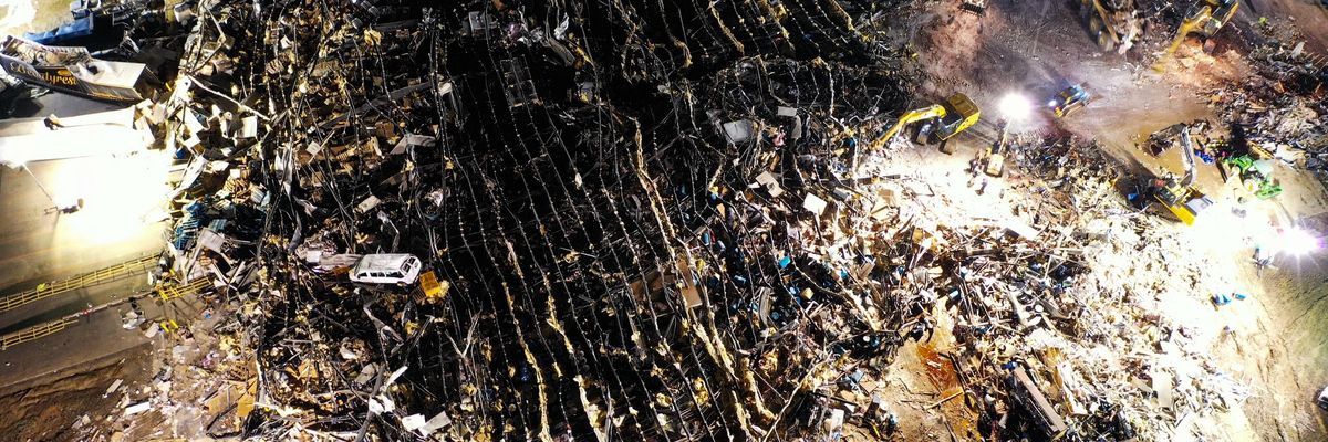 An aerial view of debris and structural damage is seen at the Mayfield Consumer Products candle factory as search and rescue operations underway in Mayfield, Kentucky on December 11, 2021