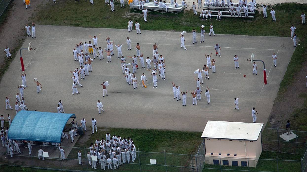 an aerial view of detainees in the yard at Alligator Alcatraz