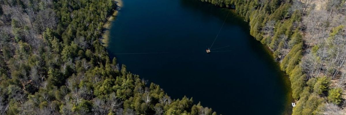 An aerial view of Lake Crawford surrounded by trees.