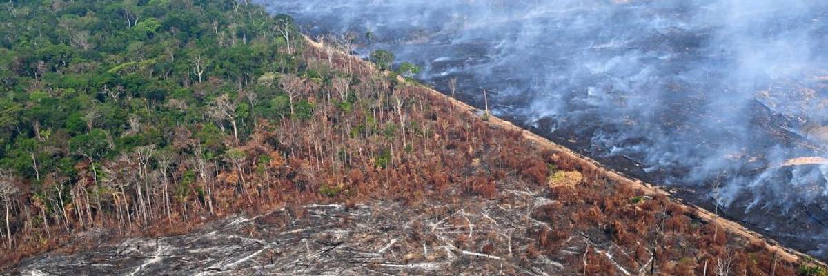 An aerial view of severe Amazon deforestation and burning