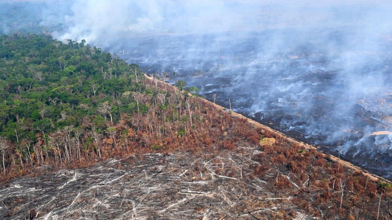 An aerial view of severe Amazon deforestation and burning