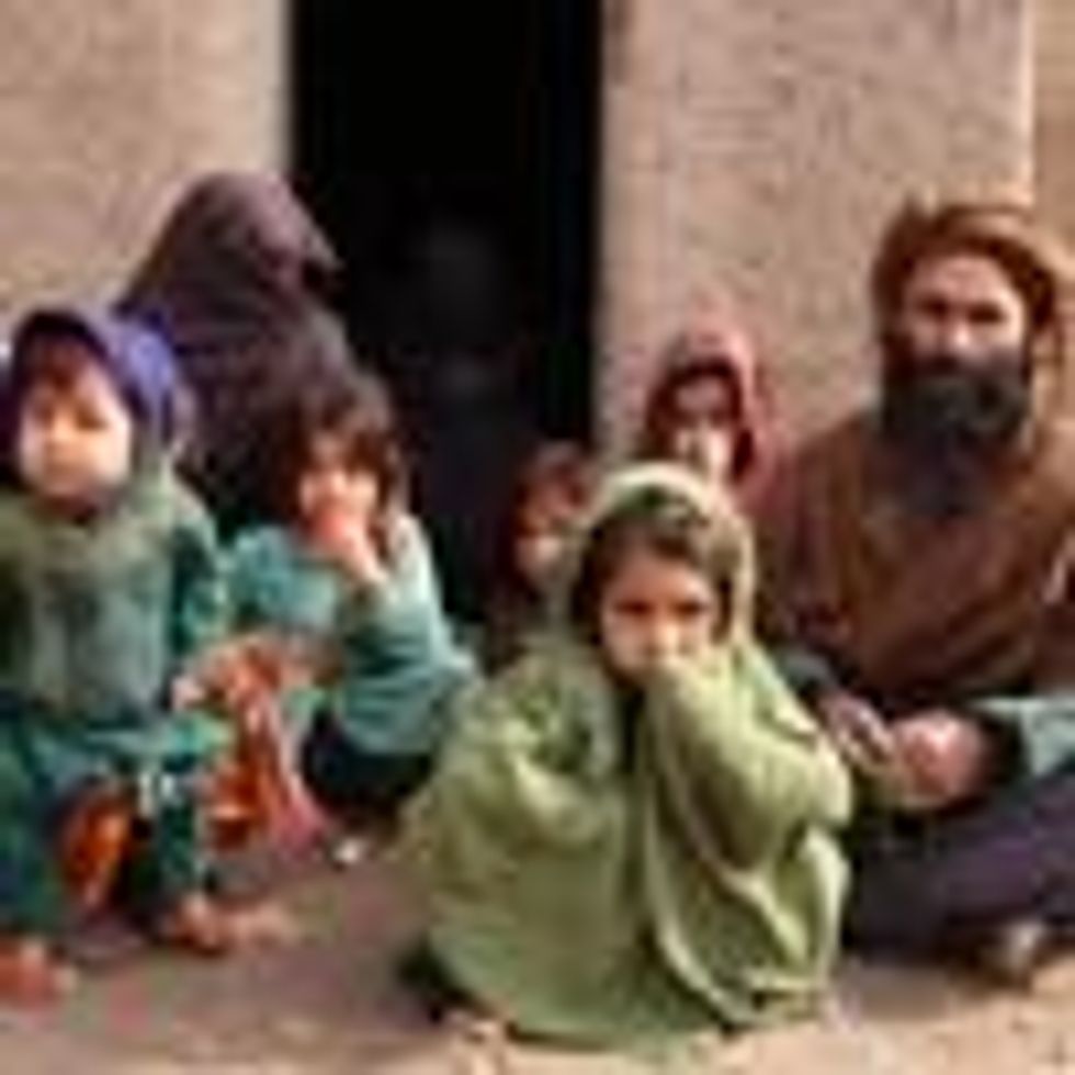 An Afghan father with his children