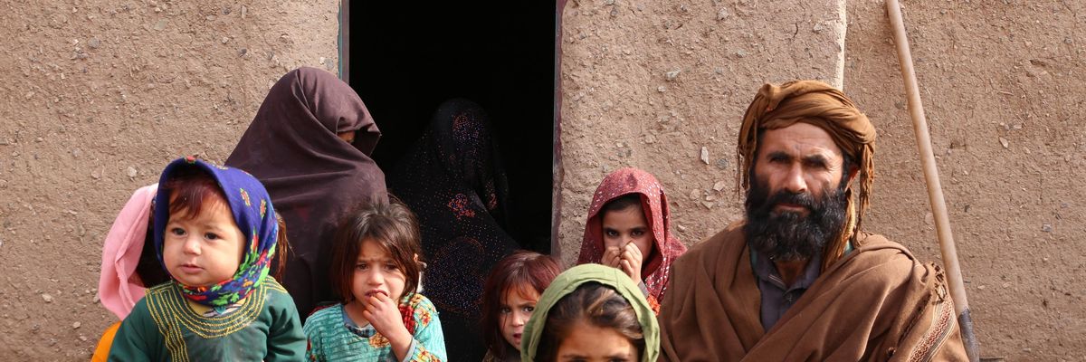 An Afghan father with his children