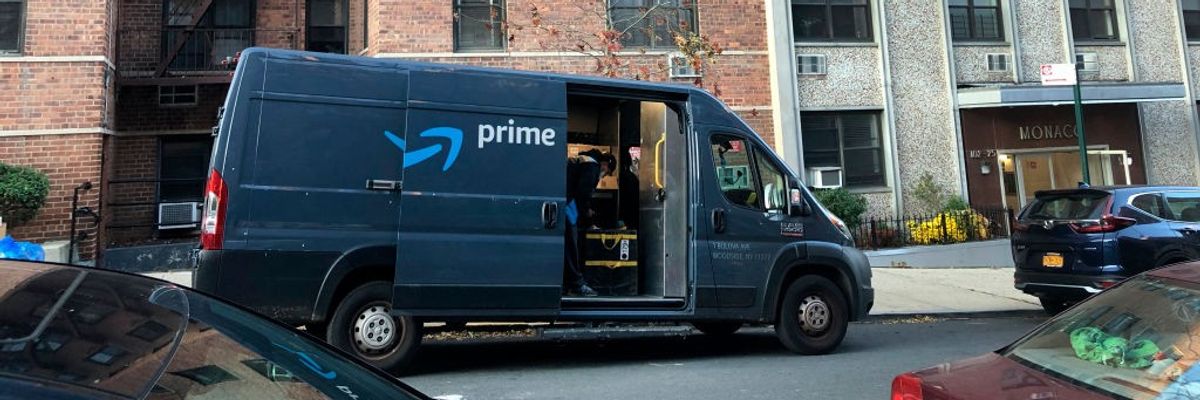 An Amazon Prime delivery van stops at an apartment building in New York City on November 20, 2020.
