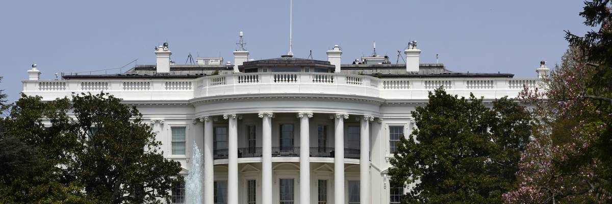 An American flag flies over the south facade of the White House in Washington, D.C.