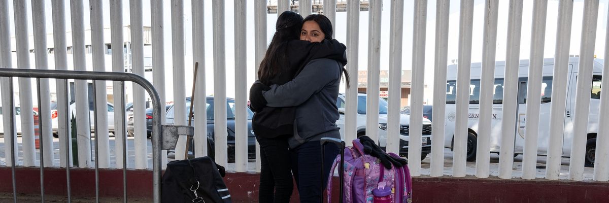 An asylum seeker from El Salvador, Silvia Martinez, holds her daughter Maria