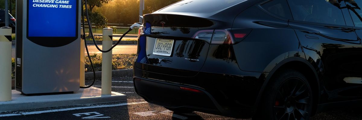 An electric vehicle is seen at a charging station in New Jersey