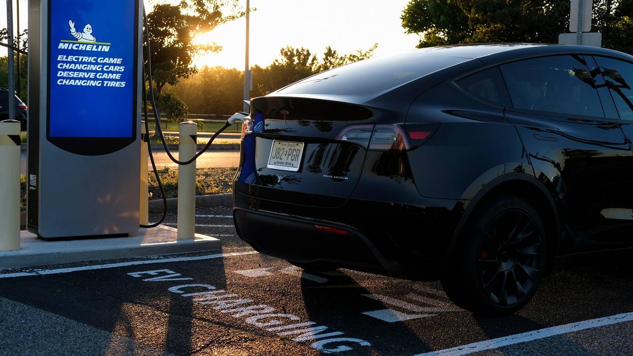 An electric vehicle is seen at a charging station in New Jersey