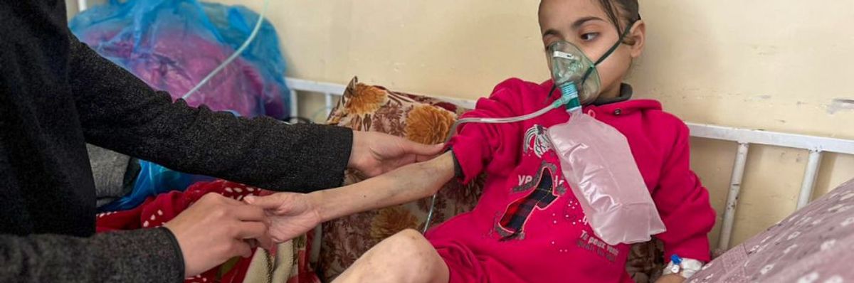 An emaciated Palestinian girl struggles to survive malnutrition in a Gaza hospital