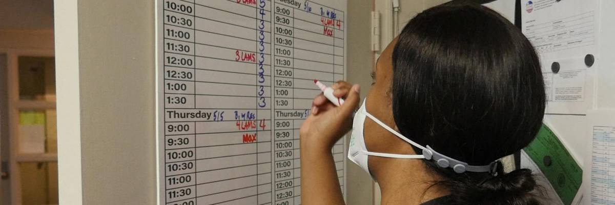 An employee at Hope Medical Group logs codes