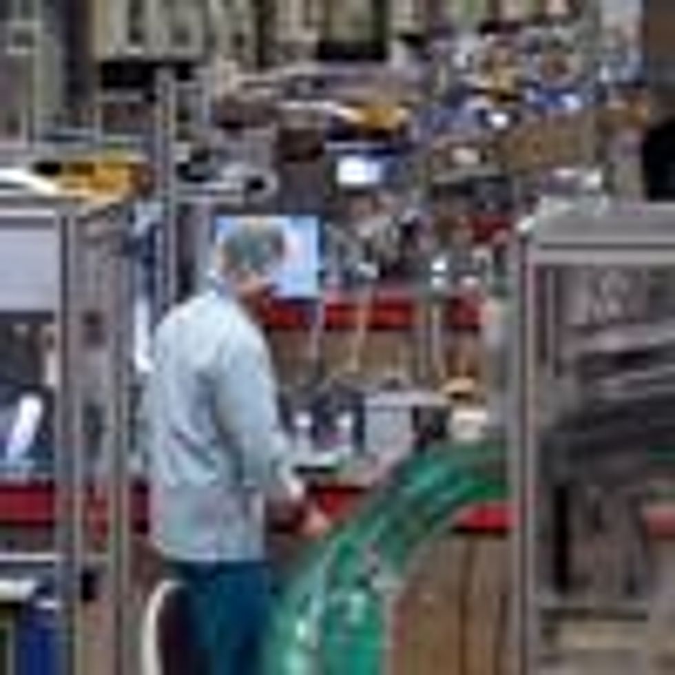 An employee of ALMO, one of the leading manufacturers of disposable syringes worldwide, works at the company's production facility in Bad Arolsen, Germany on December 15, 2020. (Photo: Ina Fassbender/AFP via Getty Images)
