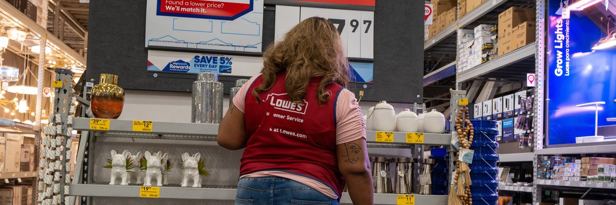 An employee works at a Lowe's store